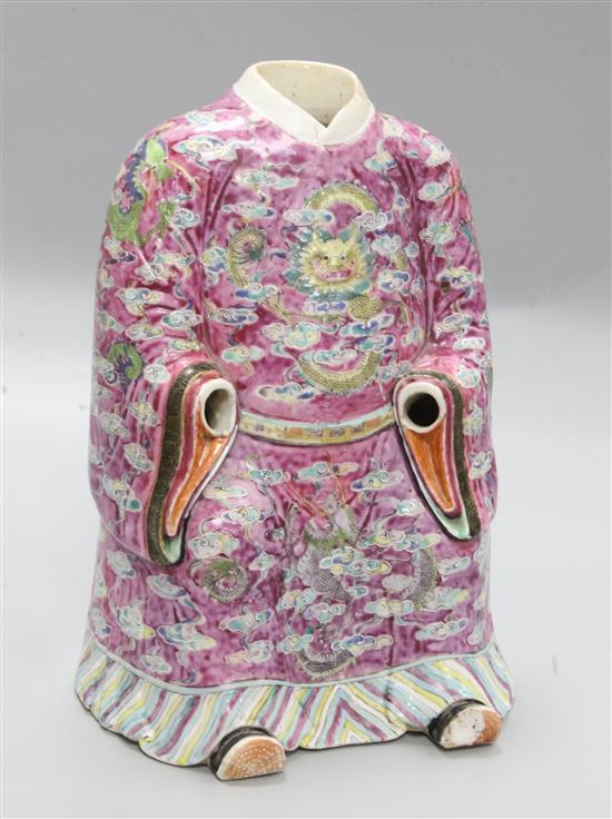 A large Chinese famille rose seated figure of an Emperor, Daoguang period (1821-50), height 30cm, cracks